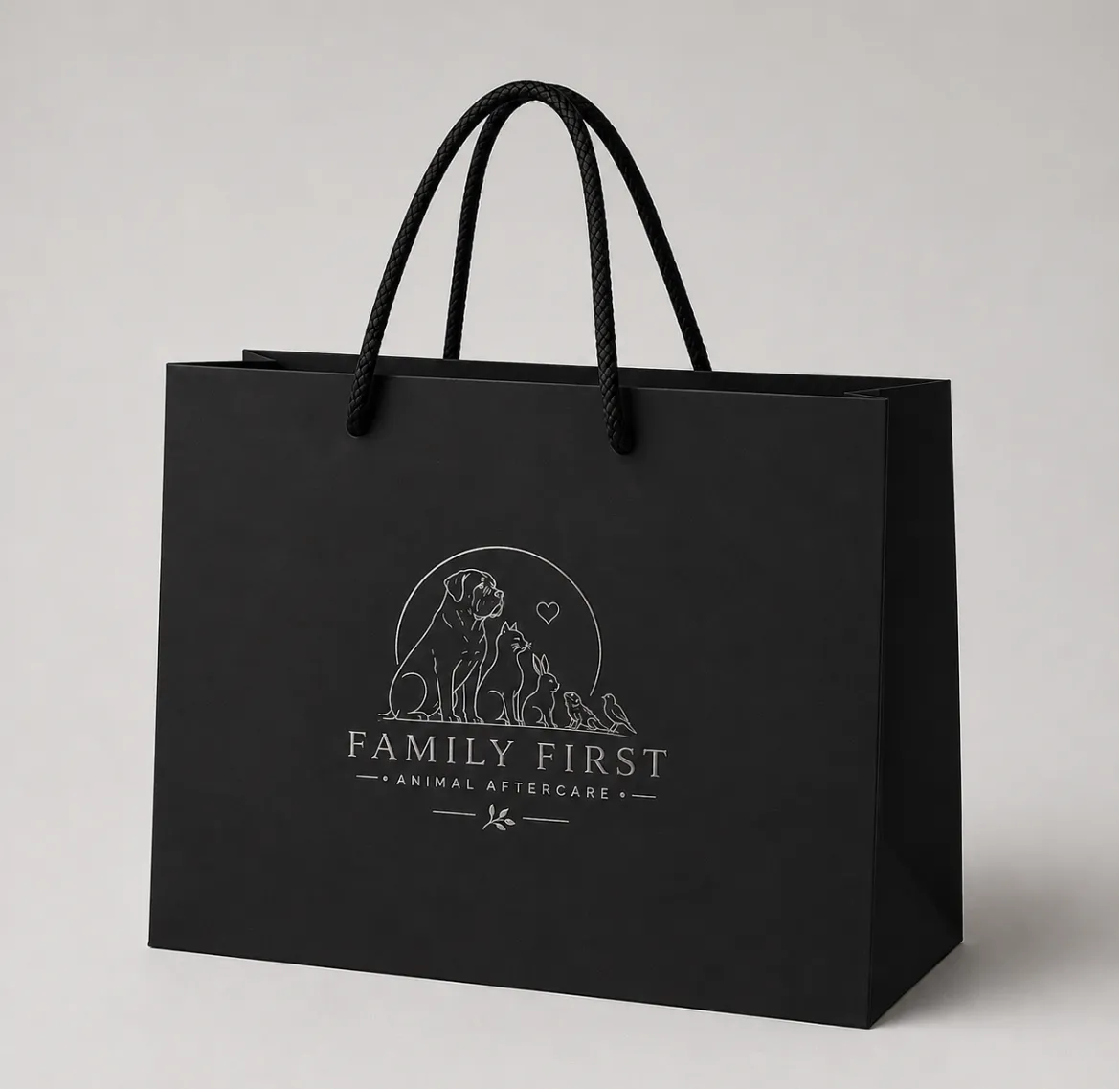 Black memorial gift bag with the Family First emblem in silver