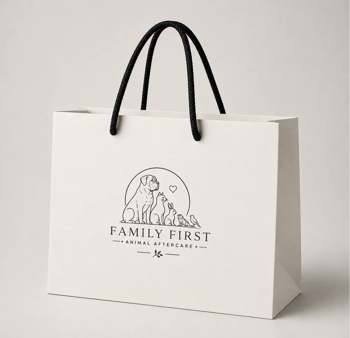 Ivory memorial gift bag embossed with the Family First line-art emblem